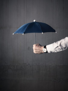 Businessman with an umbrella 